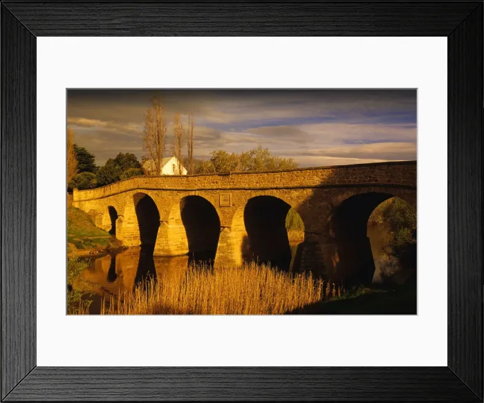 Framed Print : Afternoon light sweeps over the historic convict built stone bridge at Richmond in southern Tasmania