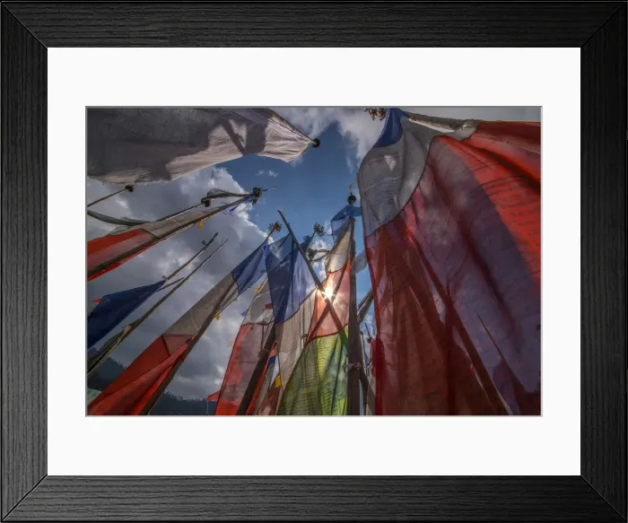 Framed Print : Prayer flags fluttering in the breeze on a mountain pass in central Bhutan Framed Print : Prayer flags fluttering in the breeze on a mountain pass in central Bhutan