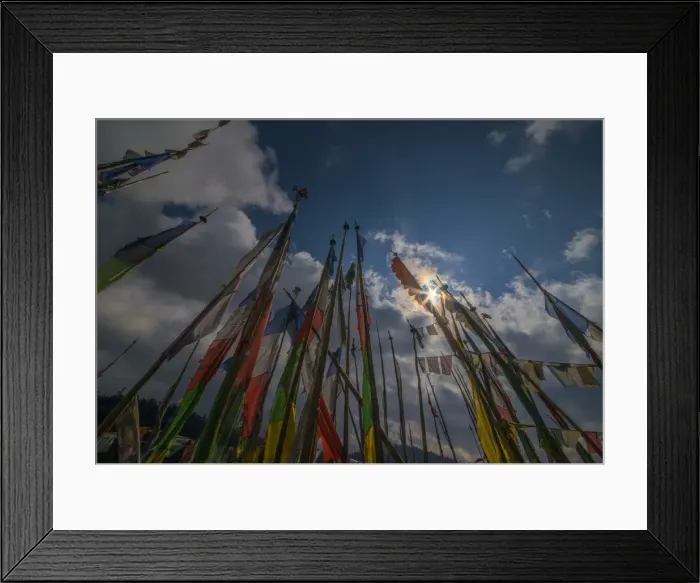 Framed Print : Prayer flags fluttering in the breeze on a mountain pass in central Bhutan Framed Print : Prayer flags fluttering in the breeze on a mountain pass in central Bhutan