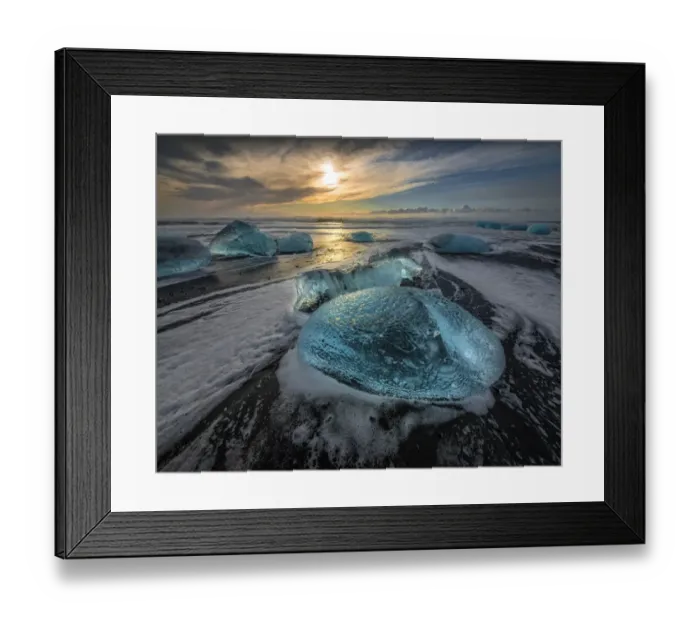 Framed Print : Jokulsarlon Beach in winter, just after a huge storm hit the coastline. Ice bergs from the nearby lagoon have been swept up onto the coastline and surge in and out with the tide Framed Print : Jokulsarlon Beach in winter, just after a huge storm hit the coastline. Ice bergs from the nearby lagoon have been swept up onto the coastline and surge in and out with the tide