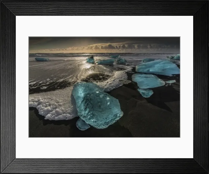 Framed Print : Jokulsarlon Beach in winter, just after a huge storm hit the coastline. Ice bergs from the nearby lagoon have been swept up onto the coastline and surge in and out with the tide Framed Print : Jokulsarlon Beach in winter, just after a huge storm hit the coastline. Ice bergs from the nearby lagoon have been swept up onto the coastline and surge in and out with the tide