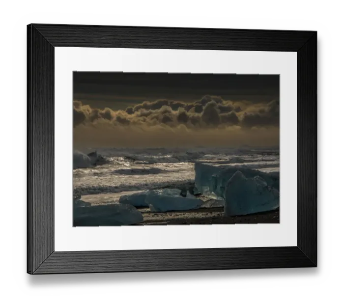 Framed Print : Jokulsarlon Beach in winter, just after a huge storm hit the coastline. Ice bergs from the nearby lagoon have been swept up onto the coastline and surge in and out with the tide Framed Print : Jokulsarlon Beach in winter, just after a huge storm hit the coastline. Ice bergs from the nearby lagoon have been swept up onto the coastline and surge in and out with the tide