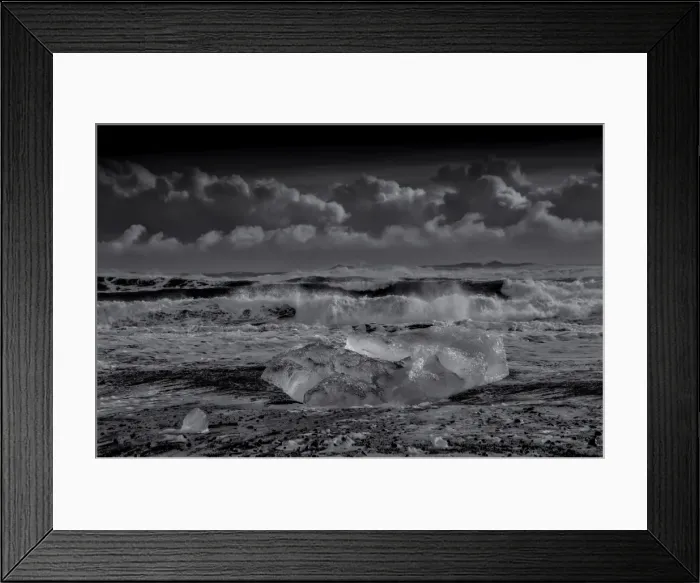 Framed Print : Jokulsarlon Beach in winter, just after a huge storm hit the coastline. Ice bergs from the nearby lagoon have been swept up onto the coastline and surge in and out with the tide Framed Print : Jokulsarlon Beach in winter, just after a huge storm hit the coastline. Ice bergs from the nearby lagoon have been swept up onto the coastline and surge in and out with the tide