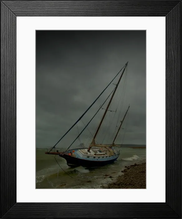 Framed Print : Beached yacht in storm