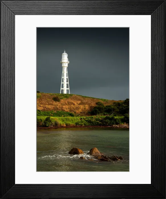 Framed Print : Currie lighthouse in stormy weather