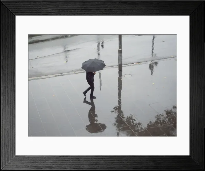 Framed Print : Walker in the rain