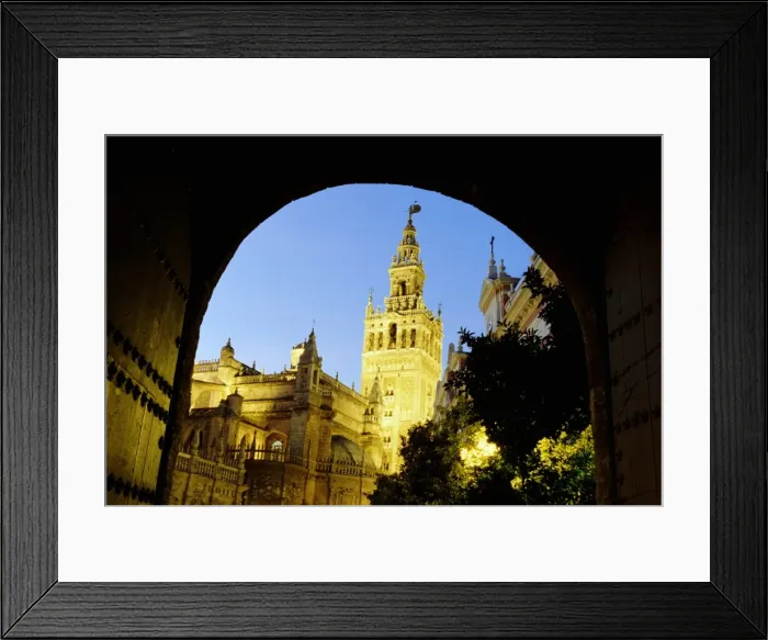 Framed Print : Spain, Andalucia, Seville, cathedral exterior, low angle view, dusk Framed Print : Spain, Andalucia, Seville, cathedral exterior, low angle view, dusk