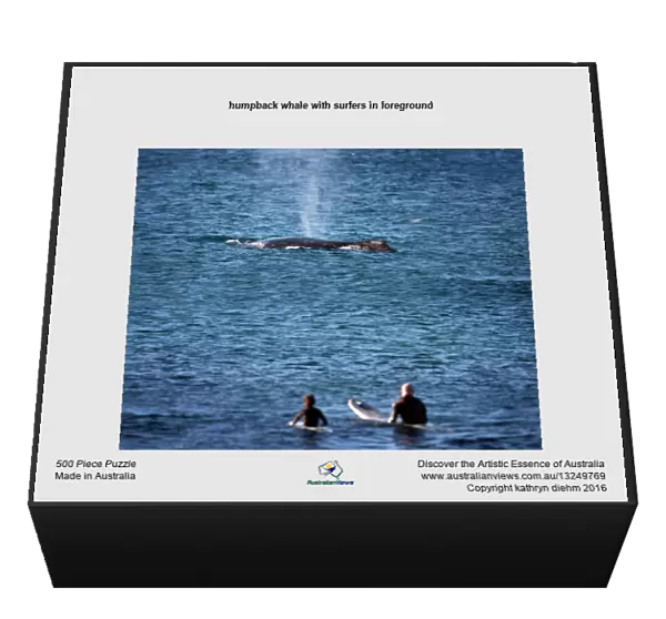 humpback whale with surfers in foreground