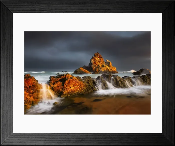 Framed Print : Rock seascape at sunset dark clouds Framed Print : Rock seascape at sunset dark clouds