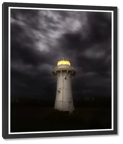 lighthouse with stormy clouds