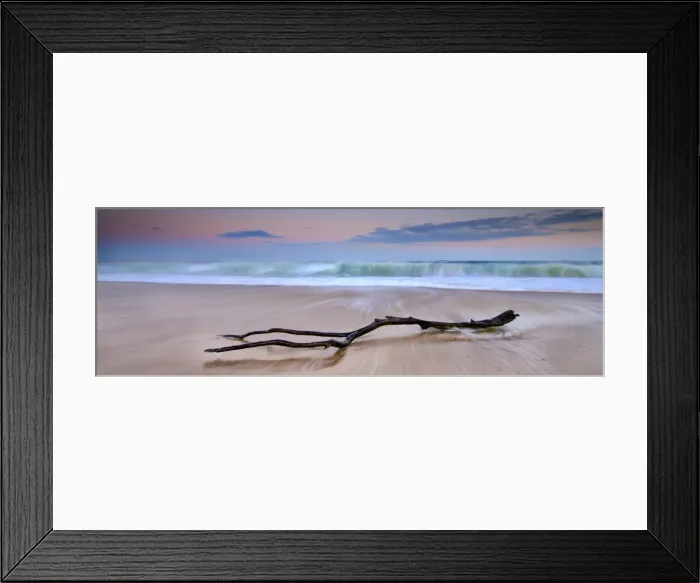Framed Print : sunrise log on beach