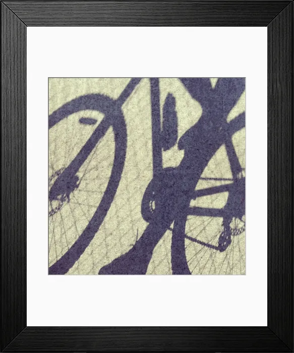 Framed Print : Shadows on concrete of person riding on a bicycle