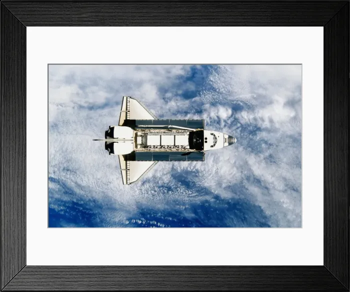 Framed Print : Space shuttle orbiting earth, satellite view