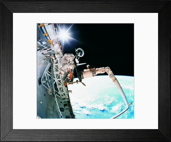 Framed Print : An astronaut working in space Framed Print : An astronaut working in space