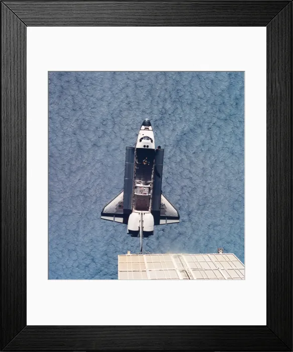 Framed Print : Elevated view of the space shuttle orbiting above earth with its cargo bay open Framed Print : Elevated view of the space shuttle orbiting above earth with its cargo bay open