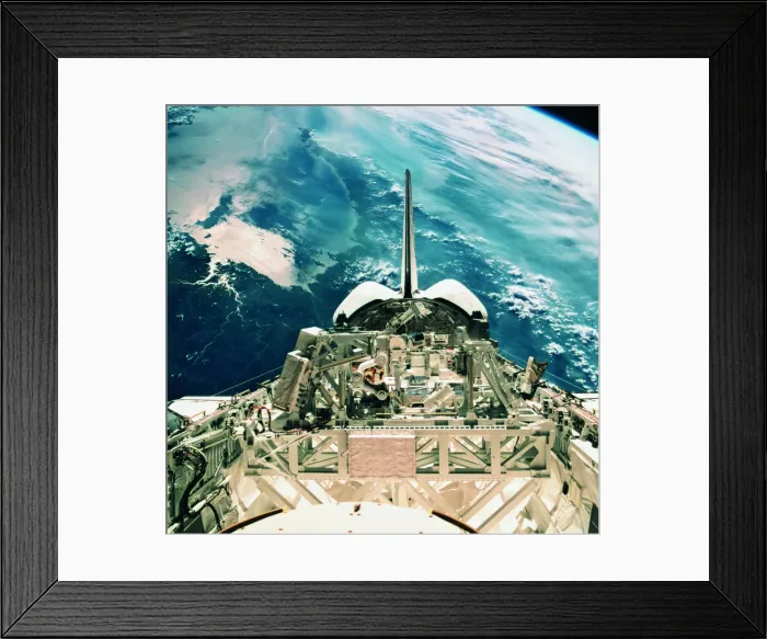 Framed Print : View of the tail section of the space shuttle orbiting above earth
