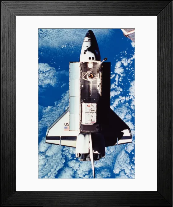 Framed Print : Elevated view of the space shuttle orbiting above the earth with its cargo bay open