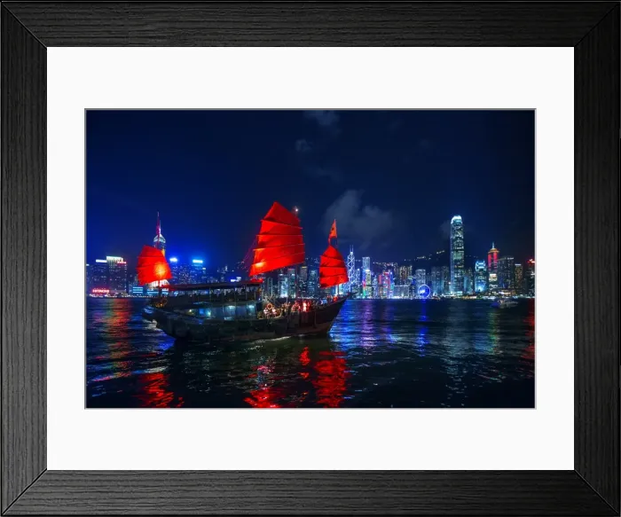 Framed Print : A Traditional Chinese Junk Sailing In Victoria Harbour With View of Hong Kong Island Skyline At Night, Hong Kong, China
