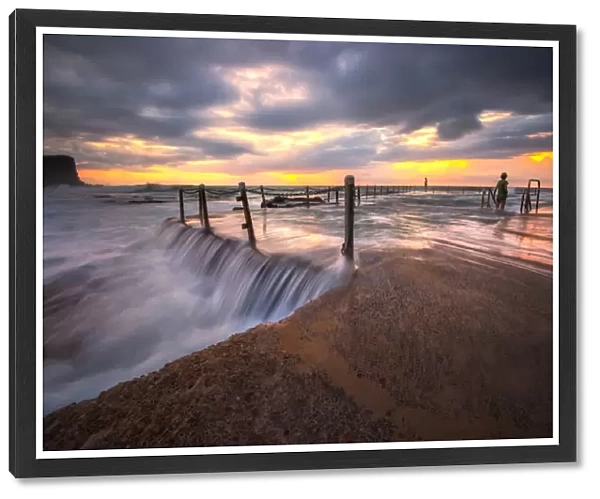 Magnificent sunrise and stunning colour over Avalon rock pool