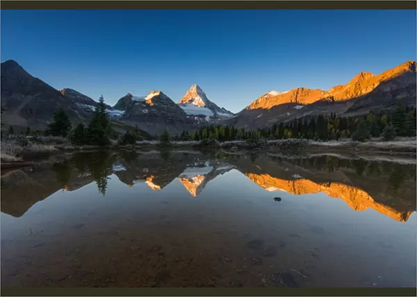 Sunrise at Mount Assiniboine with reflection