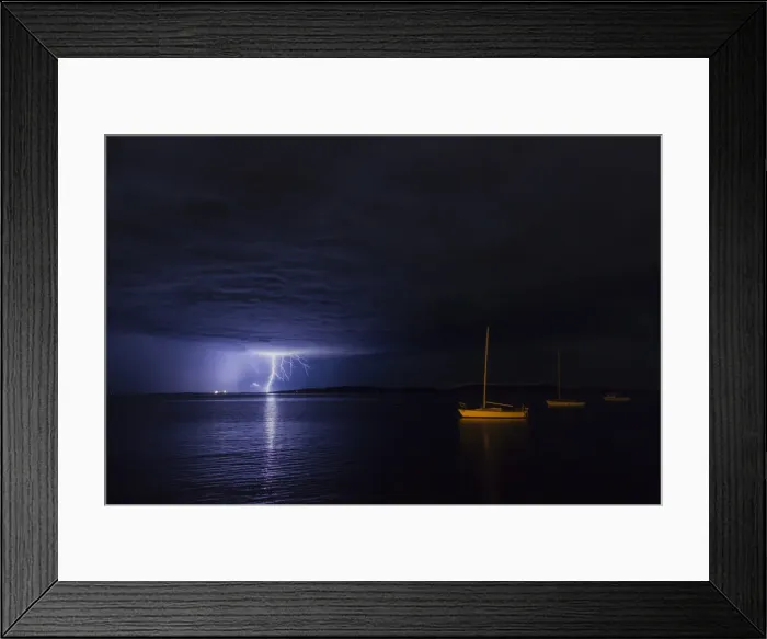 Framed Print : Lightning over moored yacht