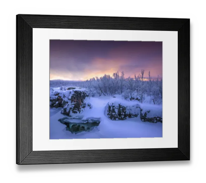 Framed Print : Dusk comes over a winter scene at Abisko National park in Lapland, Sweden