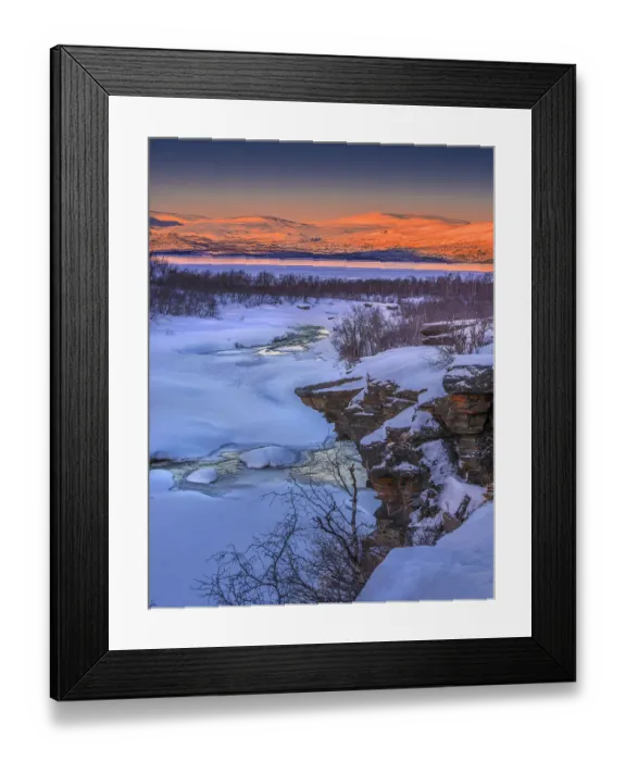 Framed Print : Dusk comes over a winter scene at Abisko National park in Lapland, Sweden