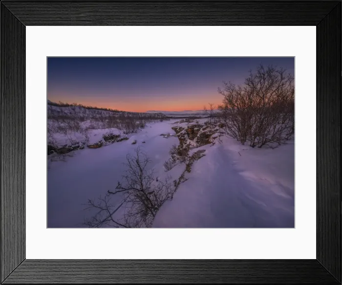 Framed Print : Dusk comes over a winter scene at Abisko National park in Lapland, Sweden