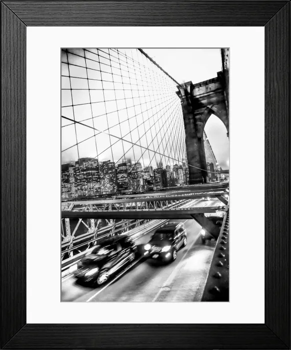 Framed Print : Two SUVs speed along the Brooklyn Bridge