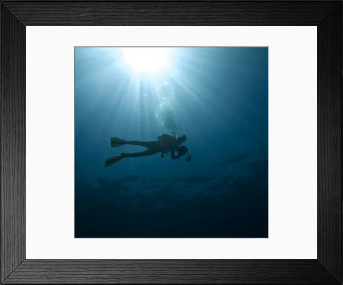 Framed Print : Scuba diver with sun burst
