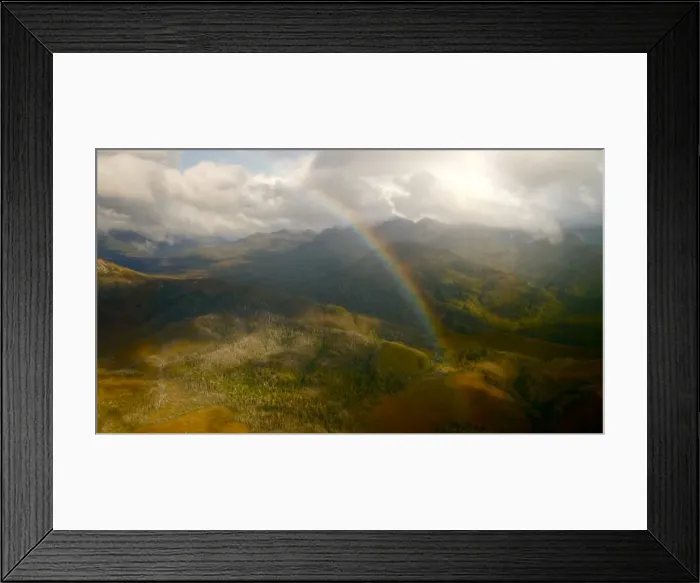 Framed Print : Tasmanian peaks with strong sunlight and rainbow