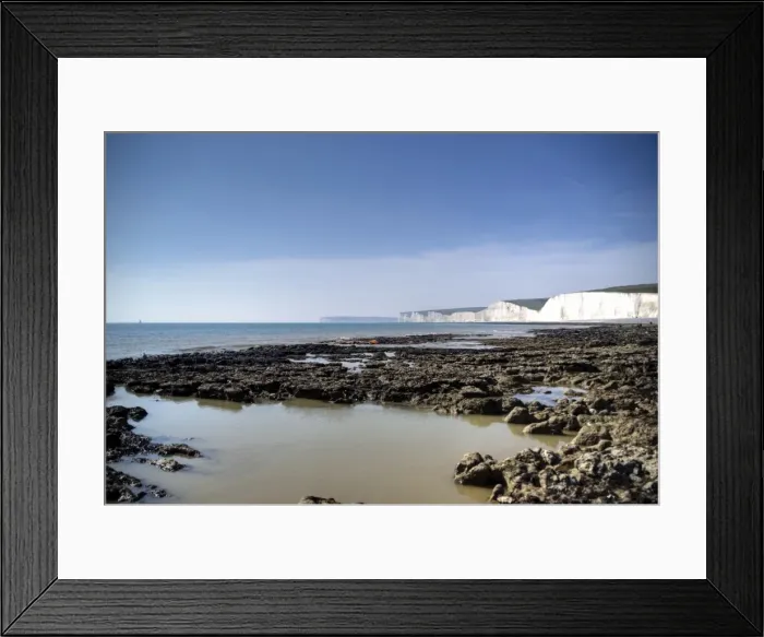 Framed Print : Seven Sisters white cliffs rocky beach at low tide