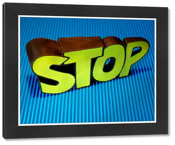 Bright yellow stop sign on blue background