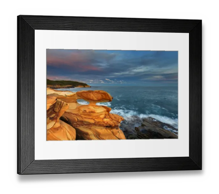 Framed Print : Sunset over spectacular coastal rocks