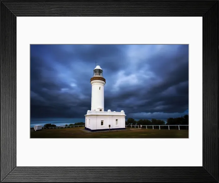 Framed Print : Lighthouse with dramatic sky