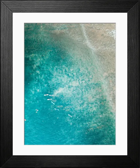 Framed Print : Aerial view of surfers on the ocean Framed Print : Aerial view of surfers on the ocean