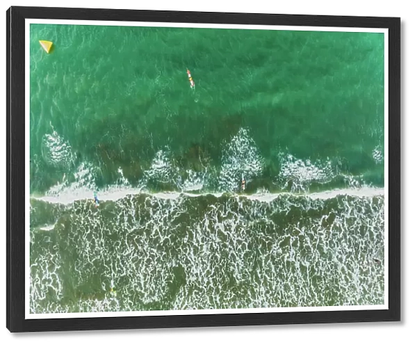 Aerial View Of Waves Splashing On Beach and People Surfing, Auckland, New Zealand