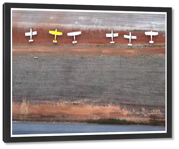 White Planes on Red Dirt Airstrip from Above