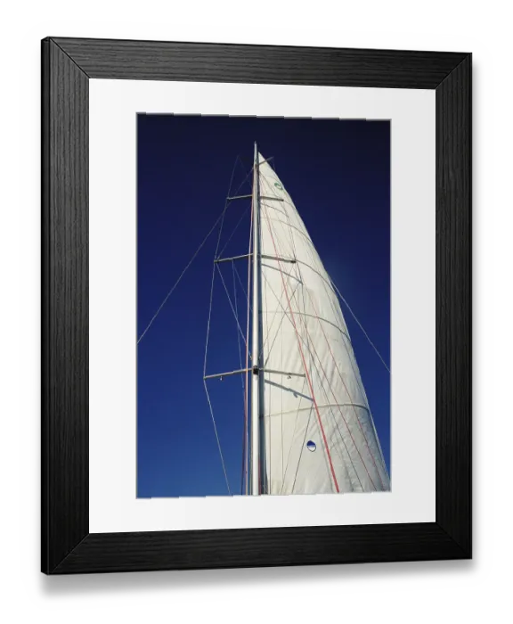 Framed Print : A boat sail and mast against blue sky Framed Print : A boat sail and mast against blue sky