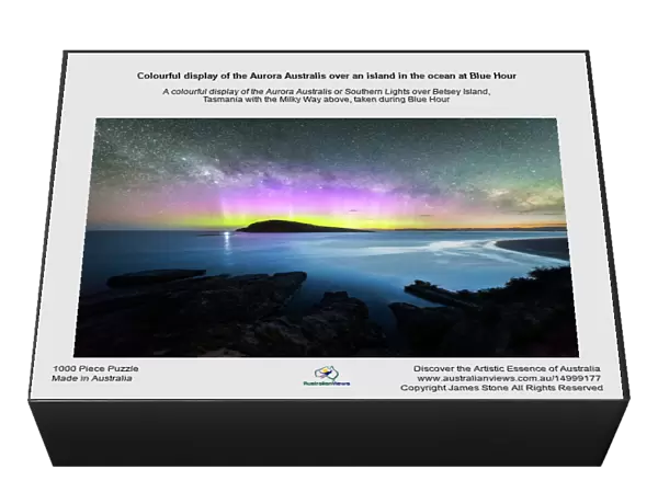Colourful display of the Aurora Australis over an island in the ocean at Blue Hour