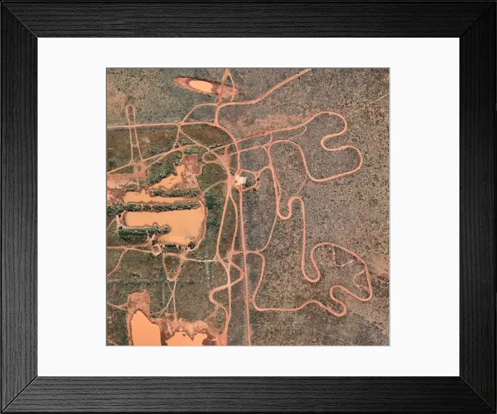 Framed Print : Winding dirt road from above Framed Print : Winding dirt road from above