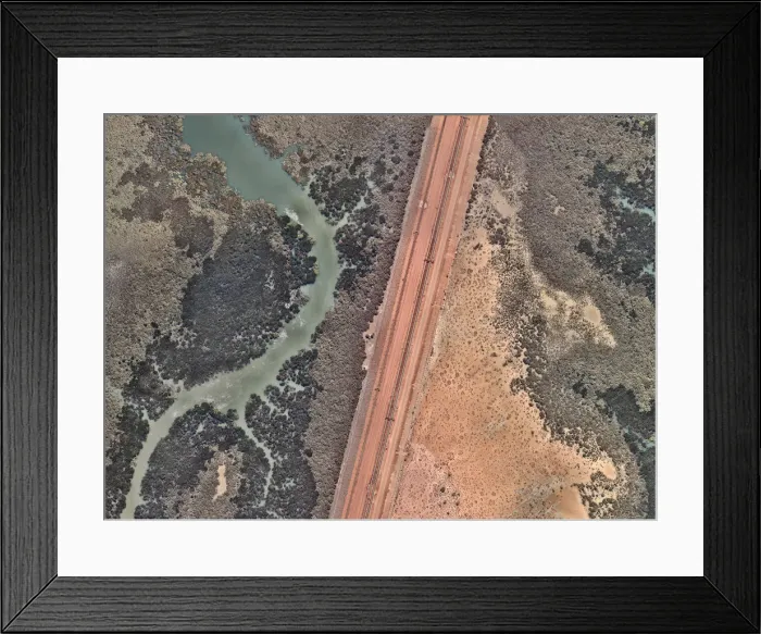 Framed Print : Train tracks crossing an estuary