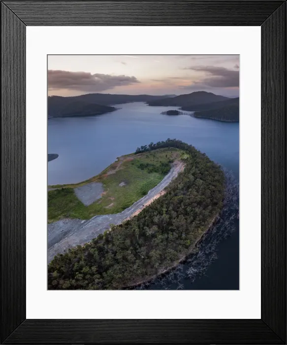 Framed Print : Hinze Dam. The Hinze Dam is a rock and earth-fill embankment dam with an