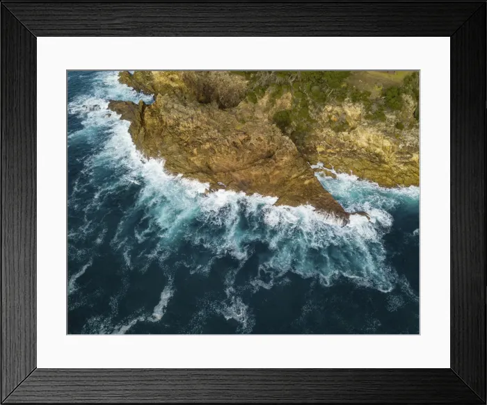 Framed Print : rocky outcrop into ocean
