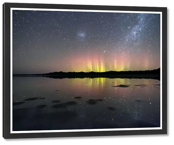 Natures Fireworks, bright beams of the Aurora Australis reflected in water