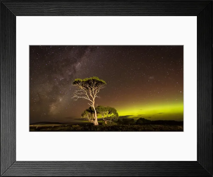Framed Print : Green arc of Aurora and the Milky Way with over an illuminated tree Framed Print : Green arc of Aurora and the Milky Way with over an illuminated tree