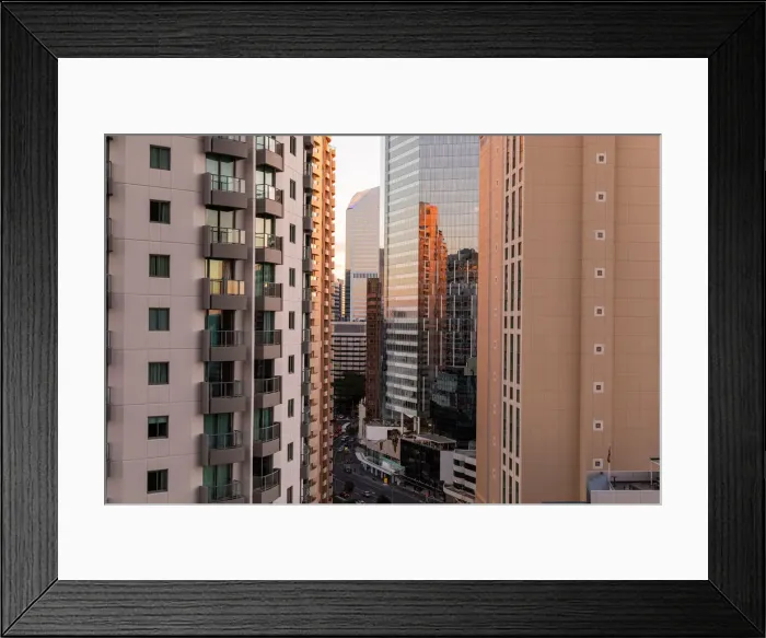 Framed Print : looking through tall buildings at sunset in Brisbane down onto the road Framed Print : looking through tall buildings at sunset in Brisbane down onto the road