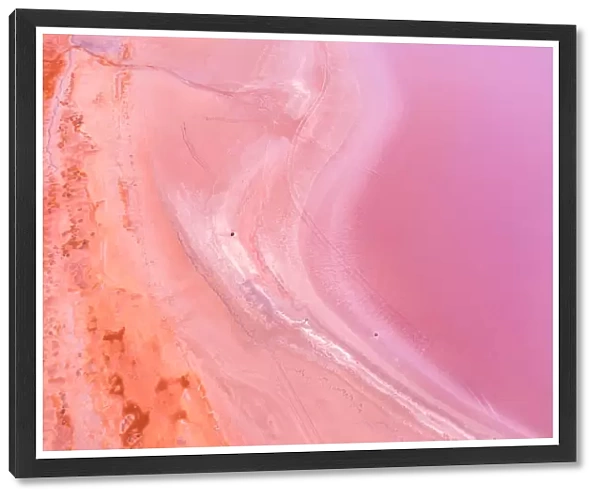 Aerial view of patterns, textures and colors, pink, purple and orange over a Pink Lake