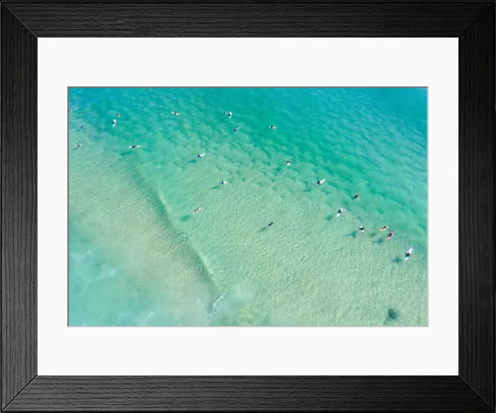 Framed Print : Aerial point of View crystal clear ocean waters with people surfing Framed Print : Aerial point of View crystal clear ocean waters with people surfing