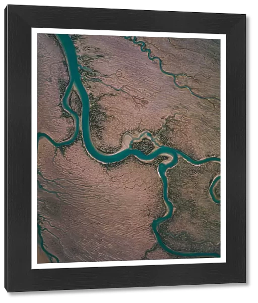 Winding river channel at low tide as seen from drones point of view, Lincolnshire
